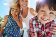 © ReeseArcurs/peopleimages.com - Happy, outdoor and portrait of mom with children for playing, bonding and fun together on holiday. Vacation, smile and mother with kids for connection, care and family in backyard from low angle.