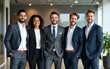 © Harper - Happy diverse business team standing in the office. Five cheerful confident successful people in smart casual suits smiling and posing for a group photo all together. Banner. Work and success concept