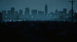 © Fagner Felix - City Skyline in Twilight: A distant cityscape silhouette against a dusky, moody sky, hinting at the energy and lives of a metropolis under the quiet of dusk.