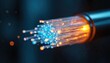 © Viktor - Close-up of fiber optic cable with multiple glass fibers glowing with orange, blue light against dark background. Illuminated fiber optics transmit data at high speed. Cable technology for modern