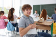 © New Africa - Teacher and students during lesson in classroom, selective focus