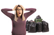 © Ljupco Smokovski - Shocked young woman in front of waste pile