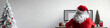 © Edgar Martirosyan - back view of santa claus sitting at the computer