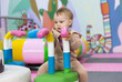 © splitov27 - Little cute baby plays in a children's entertainment center