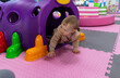 © splitov27 - Little cute baby plays in a children's entertainment center