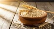 © RaNy - A wooden bowl filled with oats on a rustic wooden table with wheat ears and oats scattered around.