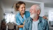 © Maryna - Woman in a blue uniform is smiling at an older man. The woman is a nurse and the man is a patient. Scene is warm and friendly, as the nurse is providing care and comfort to the elderly man