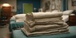 © Rasyid - Neatly Stacked Beige Linens on Hospital Beds in a Ward.