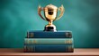 © Krystal - golden trophy rests upon stack of teal books