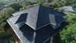 © Marharyta - Detailed close-up of gray asphalt shingles. Artificial intelligence image