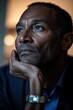© Luminostock 54 - black entrepreneur working remotely concept. Contemplative man lost in thought with a pensive expression.