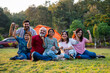 © StockImageFactory - Indian family smiling together while camping and enjoying relaxed outdoor moments