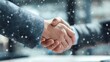 © Andrey - Business handshake on snowy winter background, corporate partnership deal, cold weather meeting, successful agreement concept, professional connection