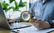 © Father_Studio - Checklist planning and workflow management concept, businessman organizing tasks, setting goals, strategies, and business process directions for efficient project execution and success.