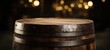 © Studio Nova - The barrel top on rustic wooden cask with warm bokeh pub lights