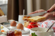 © triocean - Young woman enjoying hotel breakfast with various choice of food