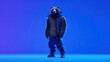 © Sergey - Majestic brown bear in futuristic techwear jacket, standing confidently on electric blue background, clean minimalistic style, bright contrast, space