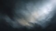 © buraratn - Dark and Gloomy Sky with Dramatic Clouds Illuminated by Subtle Light Effects in a Moody Atmosphere for Background or Artistic Use