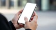 © Peahen - Woman hand holding using touch mobile phone white screen mockup Back view