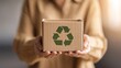 © uu - Woman holding a recycle symbol box