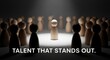 © Watie2781 - Wooden Figure Standing Out of a Group With Bright Spotlight