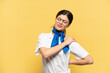 © luismolinero - Airplane stewardess isolated on yellow background suffering from pain in shoulder for having made an effort