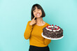 © luismolinero - Young mixed race woman holding birthday cake smiling with a happy and pleasant expression