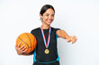 © luismolinero - Young basketball player woman isolated on white background giving a thumbs up gesture