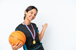 © luismolinero - Young basketball player woman isolated on white background extending hands to the side for inviting to come