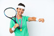 © luismolinero - Young tennis player woman isolated on white background giving a thumbs up gesture