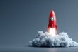 © fadillah - Red toy rocket blasting off with white cloud effect on plain background