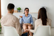 © Prostock-studio - An Arab couple attends a therapy session with a psychologist to discuss their marital challenges. They sit with their backs to the camera in a comfortable office setting.