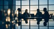 © Fa_art - Business meeting at sunset Silhouette of business people discussing at conference table with laptops and glasses Concept of entrepreneurship