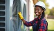 © Pete - Female air conditioning tech checks outdoor unit. Woman in uniform, hardhat services cooling system. Repairwoman repairs conditioner. Pro maintenance worker provides hvac service, maintenance with