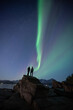 © Pedro - Couple enjoying a night under the Northern Lights in Tromso, Norway