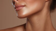 © Marut - Smooth glowing skin close up of female face jawline lips and neck under warm golden lighting healthy complexion beauty skincare sensual soft focus