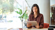 © Stock 4 You - Smiling latin hispanic young woman using pad computer for business app. Busy executive CEO businesswoman professional holding digital tablet pc device for work in modern office. Banner, copy space