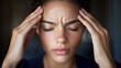 © Vlad - Stressed Woman Holding Her Head While Working on a Laptop at Home