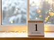 © katjabakurova - Calendar shows December 1 with cozy winter scene and warm lights around window