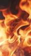 © Your Hand Please - Slow motion flames rise against a dark background showing flowing fire glowing embers and heat energy creating a dramatic scene of power motion and transformation