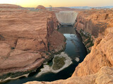 Glen Canyon Dam and Bridge in Page, Arizona. A concrete arch-gravity dam built by the Bureau of Reclamation on the Colorado River forms Lake Powell within Glen Canyon National Recreation Area.