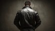 © Andrii - Man In Leather Jacket Poses With His Back To The Camera In Studio Setting. Image Captured In Horizontal Orientation. Portrait Concept.