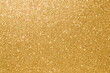 © Saichol - gold sparkle glittering background