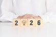 © Jo Panuwat D - 2026 year block with lightbulb. Business Idea, Creative, Thinking, brainstorm, Goal, Resolution, strategy, plan, Action, change and New Year start concepts