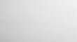 © Celt Studio - Angled view of white paper background with fine texture and perspective, empty bright surface of premium cardstock for elegant design or professional mockup template for website