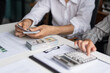 © Charlie's - Business People Accountant Counting Banknotes During Cash Audit with Cash Flow Management Holding and Giving Dollar Banknotes
