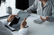 © Wanda - Business people working together in office