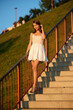 © dima266f - Slavic Woman in White Dress on Staircase