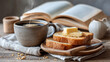 © Jane_S - Warm breakfast scene with coffee, buttered toast, and open book