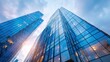 © hao - Modern office building with blue sky, and glass facades. Economy, finances, business activity concept, Bottom-up view, blurred image. High quality